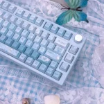 Ethereal Misty Blue Butterfly PBT Dye-Sub Keycaps Set from multiple angles. Highlights delicate butterfly designs and soft pastel colors for a dreamy design.