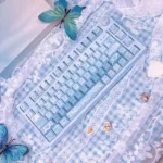 Ethereal Misty Blue Butterfly PBT Dye-Sub Keycaps set from artistic angles, highlighting delicate blue butterfly designs and soft pastels for a dreamy upgrade.