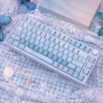 Ethereal Misty Blue Butterfly PBT Dye-Sub Keycaps set, showcasing delicate blue butterflies and soft pastels on a keyboard for a dreamy aesthetic.