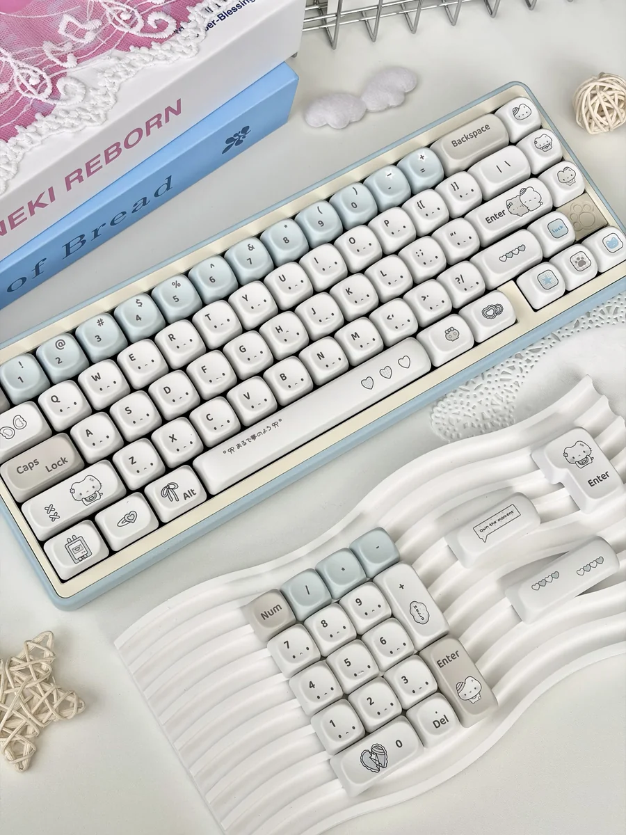 A charming close-up of Blue Dazed Cat Series Keycap Set, highlighting their adorable, whimsical pastel cat designs and the versatile profiles from a fresh perspective view.
