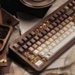 Close-up of a playful Brew-tiful coffee keycap set for mechanical keyboards, showcasing warm PBT dye-sub caps with charming cat accents and modern tribute.