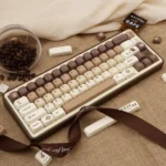 Playful Coffee Keycap Set for mechanical keyboards. Unique PBT dye-sub keycaps with warm cat and transparent details, viewed from various angles.