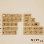 Charming transparent PC coffee supplement 32-key set, featuring warm coffee aesthetics and playful cat accents, neatly boxed for your mechanical keyboard.