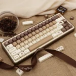 Playful Brew-tiful coffee keycap set for mechanical keyboards, showcasing warm tones, cute cat accents, and unique transparent PBT dye-sub keys.