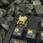 Close-up of the handcrafted Bright Fortune Cat Keycaps, revealing its charming details and lustrous precious metallic finish from a unique angle.