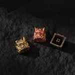 A collection of handcrafted Oni Warrior keycaps, showcasing intricate Japanese warrior designs from various angles in polished finishes.