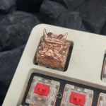 Handcrafted Oni Warrior keycap featuring an intricate Japanese warrior design in a striking polished copper finish, embodying a fierce mythical aesthetics.