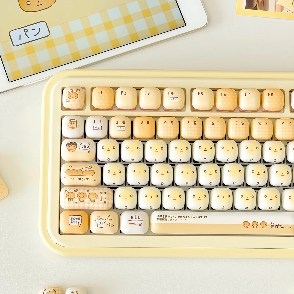 Playful Burnt Toast PBT keycaps set with warm hues and crisp dye-sub legends, shown from various angles, mimicking toasted bread.