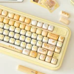 Unique Playful Burnt Toast PBT dye-sublimated keycaps set from various angles, showcasing warm toasted with crisp legends, mimicking burst design.