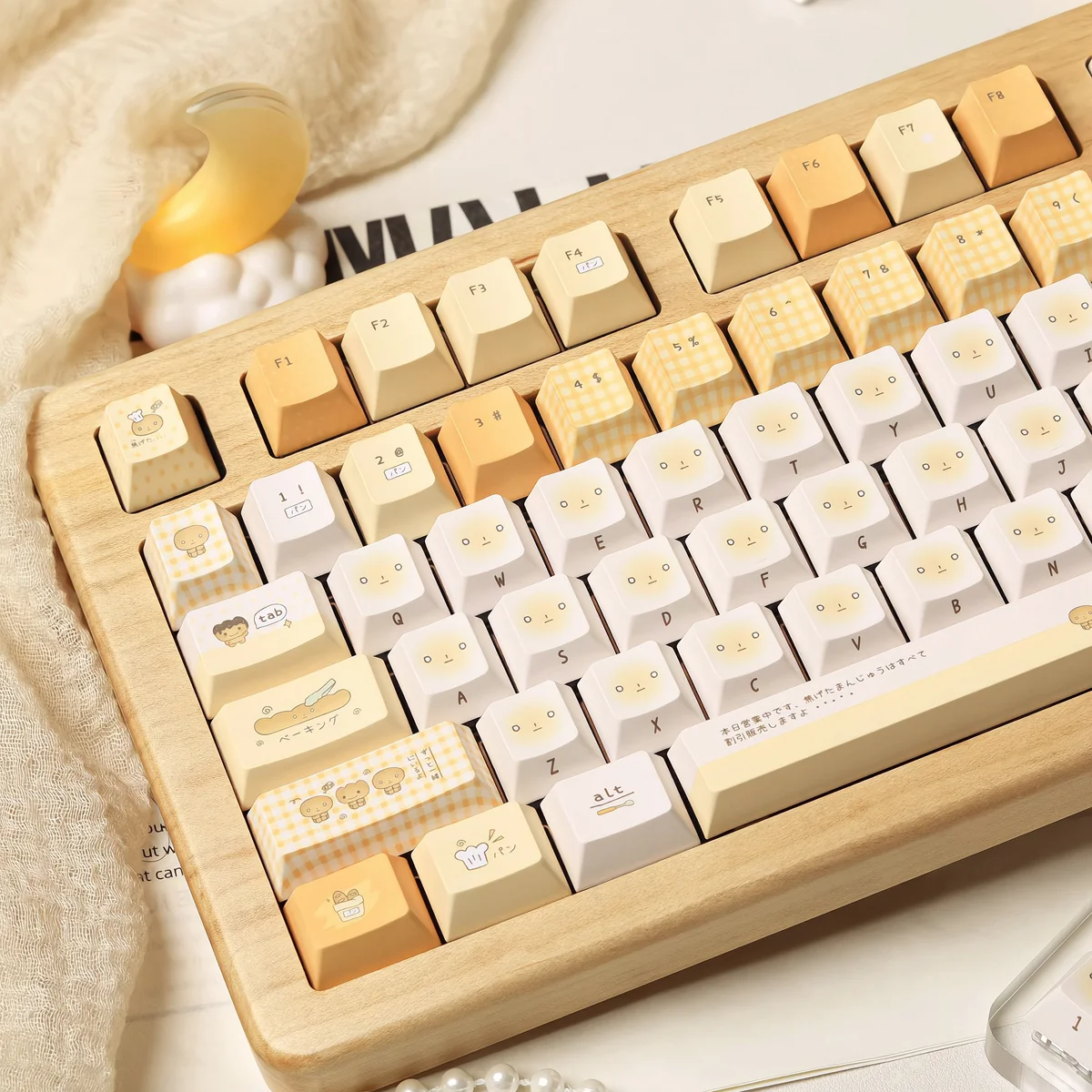 A playful gallery of unique Burnt Toast PBT dye-sublimated keycaps set, showcasing various angles of their warm toasted design with crispy accent.