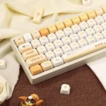 Collection of Playful Burnt Toast PBT dye-sublimated keycaps set, viewed from various angles. Features unique toasted designs with crisp design.