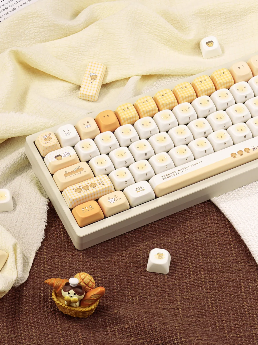 Collection of Playful Burnt Toast PBT dye-sublimated keycaps set, viewed from various angles. Features unique toasted designs with crisp design.