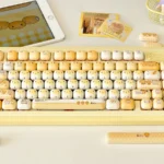 Playful MOT Burnt Toast PBT keycap set (135 keys) in a box, showcasing warm browns and crisp legends design.
