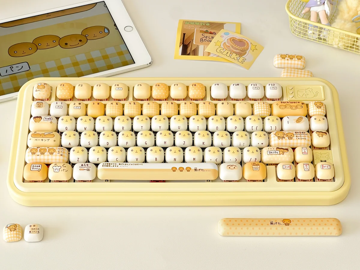 Playful MOT Burnt Toast PBT keycap set (135 keys) in a box, showcasing warm browns and crisp legends design.