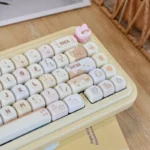 Adorable Sweet Treat MOA PBT Cake Keycap Set, showcasing its whimsical pastel cream design and ergonomic MOA profile for mechanical keyboards.