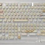 Sweet treat MOA PBT Cake keycap set from a playful angle, highlighting its adorable cream design and whimsical pastel details for keyboards.