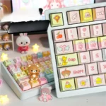 Whimsical Cardcaptor Sakura & Friends keycaps set displayed from a playful, magical perspective, featuring vibrant pink and gold anime motifs on a mechanical keyboard.
