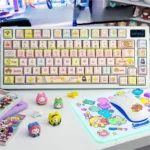 A magical Cardcaptor Sakura keycap set, featuring vibrant pink and gold keys adorned with iconic anime motifs, bringing whimsical charm to any keyboard.