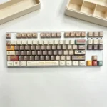 Close-up of the Cassette Gentleman PBT Dye-sub Keycap Set, highlighting its unique retro-gentleman aesthetic and durable PBT legends with vintage tech.
