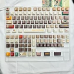 Cassette Gentleman PBT Dye-sub Keycap Set. Multiple angles reveal its unique retro-gentleman aesthetic, durable PBT, vintage tech motifs, and premium design.