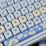Unique Ocean Serenity PBT MOA Sea Salt Cat Keycap Set shown from multiple angles, highlighting its tranquil blue tones, playful kitten art, and distinctive art.