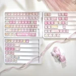 Playful translucent PC cat Squad keycaps set with side prints, viewed from diverse angles, showcasing their whimsical design and vibrant RGB appeal.