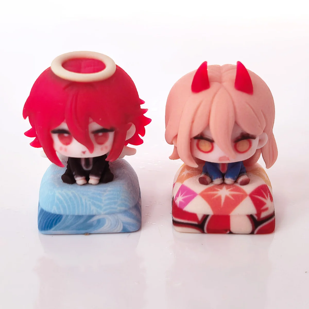 Handcrafted Chainsaw Man Angel Devil artisan keycap, intricately sculpted from multiple angles, showcasing its dark fantasy anime aesthetic.