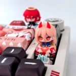 Close-up of a handcrafted Chainsaw Man Angel Devil artisan keycap, showcasing its intricate 3D sculpt and dark fantasy anime aesthetic from multiple angle.