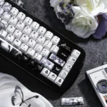 Exclusive handcrafted Chainsaw Man Reze ceramic keycaps set. Detailed view from multiple angles, highlighting smooth, durable surfaces and iconic characters.