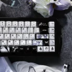 Close-up view of an exclusive Chainsaw Man Reze ceramic keycap set, showcasing the smooth, handcrafted details and iconic character art from multiple angle.