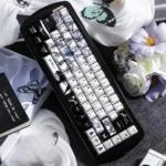 Exclusive Chainsaw Man Reze ceramic keycaps set, handcrafted with iconic character art, displayed beautifully on a keyboard, highlighting premium craftmanship.