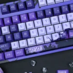 Exclusive Chainsaw Man Reze PBT Keycap Set shown from various angles, highlighting its vibrant, dynamic character art for a premium keyboard.