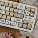 Detailed shot of the whimsical cheeseburger cat PBT keycap set, showcasing its playful cartoon design and vibrant colors, perfect for a fun mechanical keyboard.