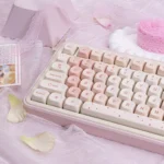 Close-up of MOA profile PBT Cherry Blossom Keycaps set, showcasing their delicate pink motifs and durable texture from various artistic angles for a serene design.