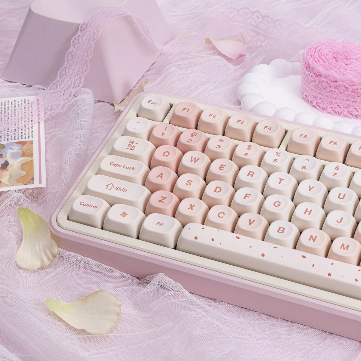 Close-up of MOA profile PBT Cherry Blossom Keycaps set, showcasing their delicate pink motifs and durable texture from various artistic angles for a serene design.