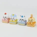 Charming Chiikawa dessert pie artisan keycap for ESC, shown from multiple angles, highlighting its adorable miniature characters and sweet, colorful setup.