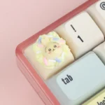 Close-up of a handcrafted Chiikawa cream tart artisan ESC keycap, showcasing its adorable pastel details and whimsical resin design.