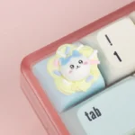 Close-up of an adorable handcrafted Chiikawa cream tart artisan ESC keycap, showcasing its whimsical pastel resin details from a unique angle.