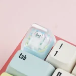 Close-up of a whimsical handcrafted Chiikawa ESC keycap made from vibrant resin, featuring an adorable character design from a unique angle.