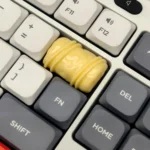 Handcrafted artisan chocolate keycap. Smooth, rich resin resembles gourmet chocolate and caramel. Multiple angles reveal its delectable design.