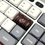 Artisan chocolate keycap handcrafted from smooth resin, showcasing its rich, delectable gourmet chocolate and caramel design from multiple angles.