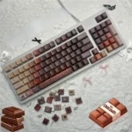 Playful gallery of durable PBT chocolate keycaps set in Cherry profile, showcasing their warm, inviting brown dye-sub colors and dessert-inspired aesthetic.