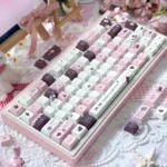 Charming close-up of Chocolate Strawberry Series Keycap Set from the Sweet Chocolate Strawberry 145-key set, showcasing its pastel pink, brown, and cream dessert-inspired.