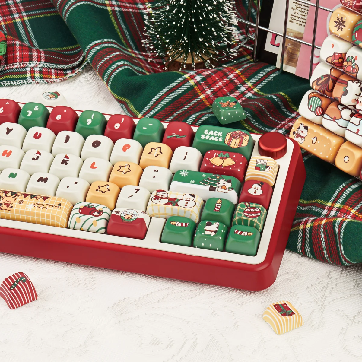Playful PBT dye-sub Christmas Gift keycap set, featuring festive red/green designs and winter wonderland characters, viewed from multiple angles.