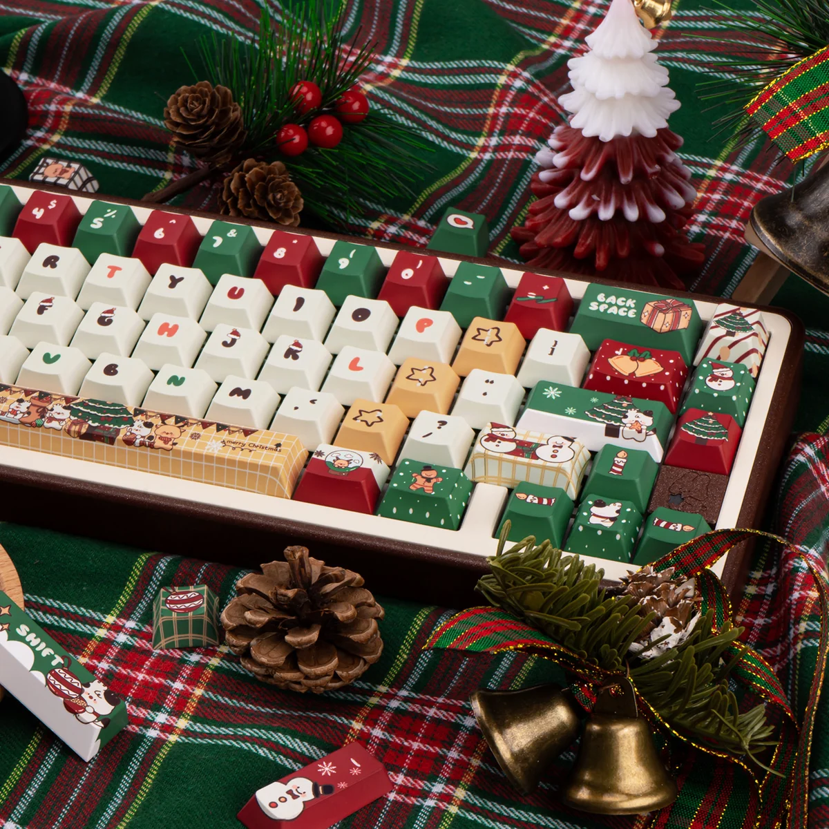 Durable PBT dye-sub Christmas Gift keycap set with playful hues and winter wonderland motifs, shown from various angles for a festive keyboard.