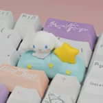 Side angle of the handcrafted Cinnamoroll nebula artisan keycap, revealing the intricate details of Cinnamoroll's playful pose against the dreamy cosmic design.
