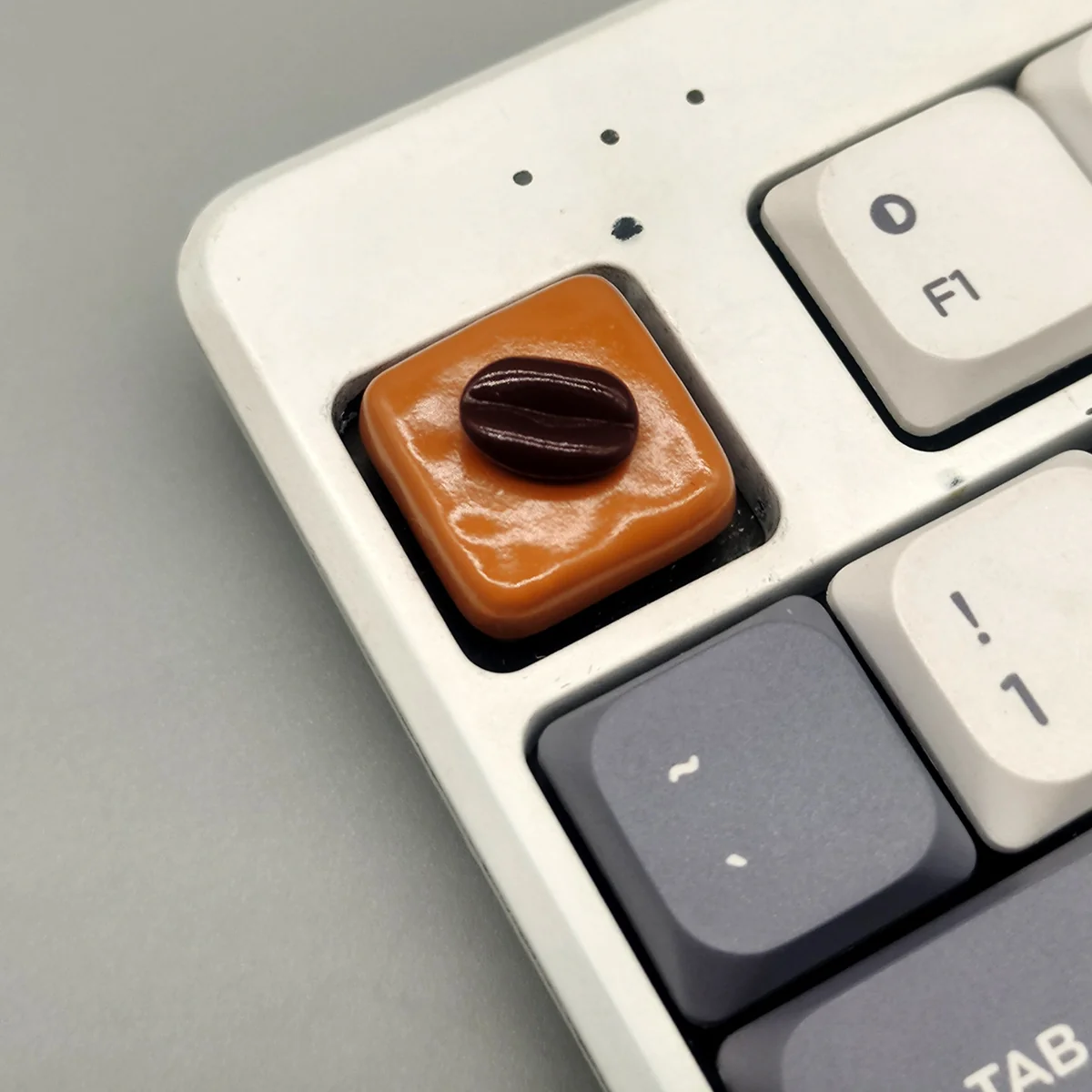 Playful Caramel Coffee Bean Chocolate Low Shaft Keycap featuring a rich caramel coffee bean design, handcrafted with a warm, inviting dessert and coffee aesthetic.