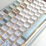 Artistic Collage Mood Keycap Set, highlighting its unique side-lit design and translucent side-engraved legends. Focus on the abstract design.