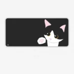 Close-up of Playful Cow Cat Desk Mat, showcasing their whimsical black and white patterns for working desk, adding a unique, charming aesthetics.