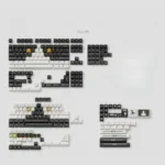 Distinctive Cow Cat PBT keycap set displayed from multiple artistic angles, showcasing its high-contrast black and white design with playful feline design.